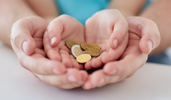 38662893_m 38662893 - family, children, money, investments and people concept - close up of father and daughter hands holding euro money coins